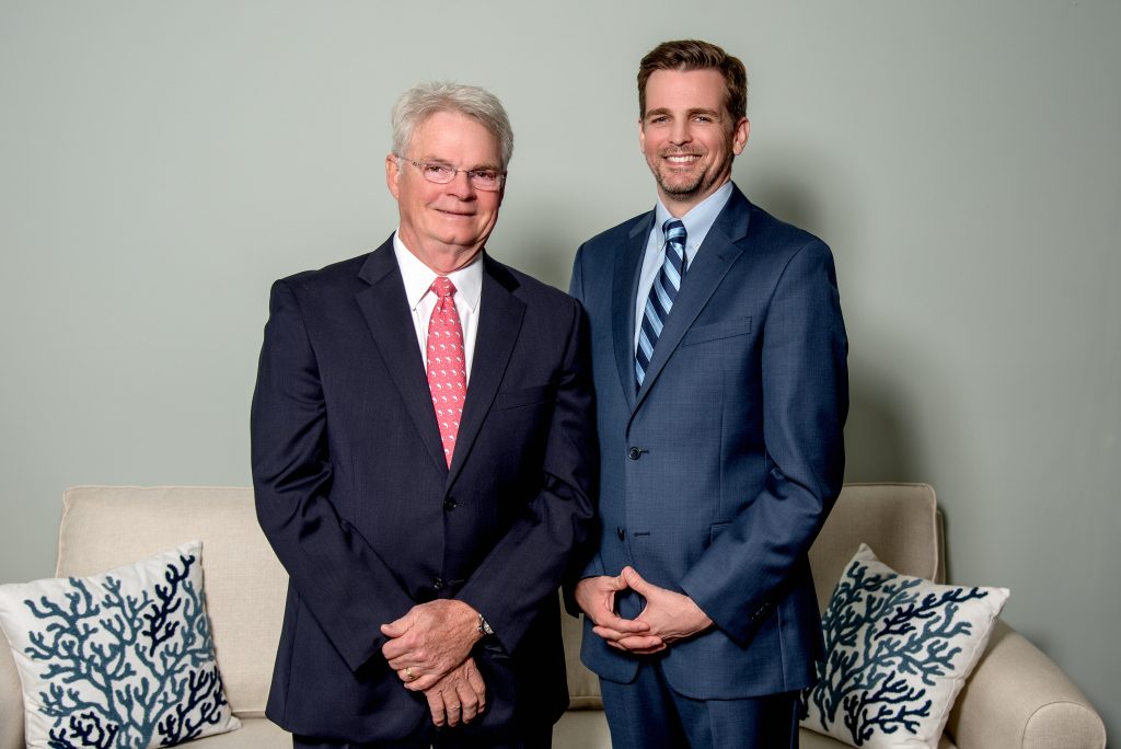 Dr. Dowden and Dr. Nimtz wearing dark suits standing together and smiling