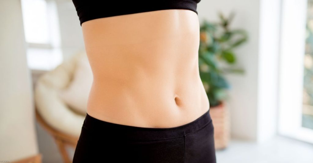A woman's stomach after tummy tuck surgery. (Model)